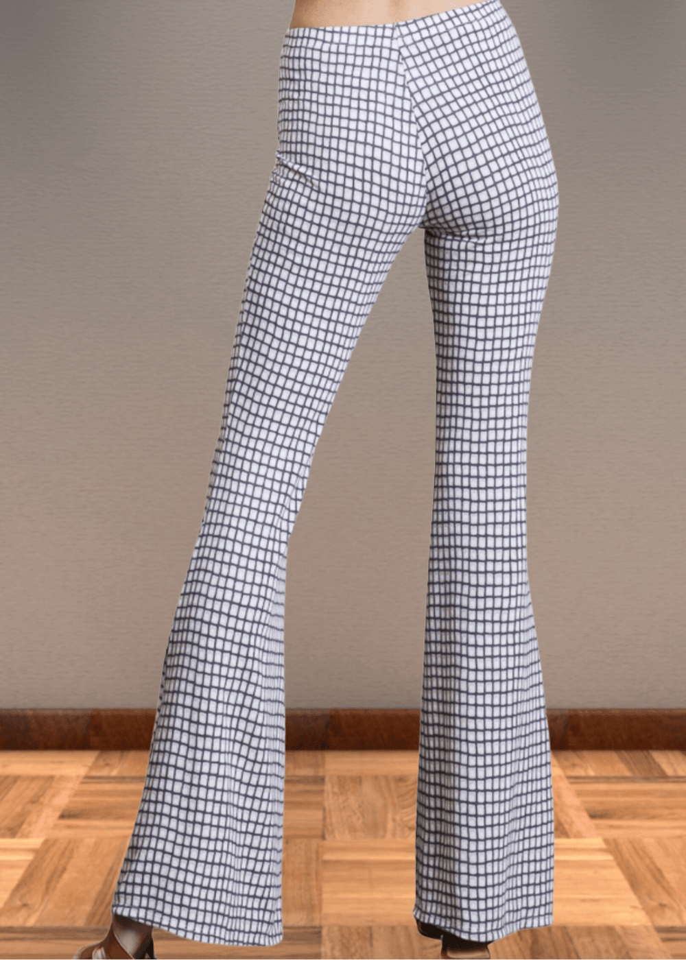 Step up your style game with these Jersey Plaid Skinny Flares, designed to flatter every curve with their mid-rise, slim-fit cut that elegantly flares at the ankle. Made from a luxuriously soft jersey fabric blend, they offer unbeatable comfort and stretch for all-day wear. The timeless black and off-white plaid pattern adds a bold yet classic touch, making these pants perfect for turning heads whether at the office or out on the town. Bucket List Style P5009D