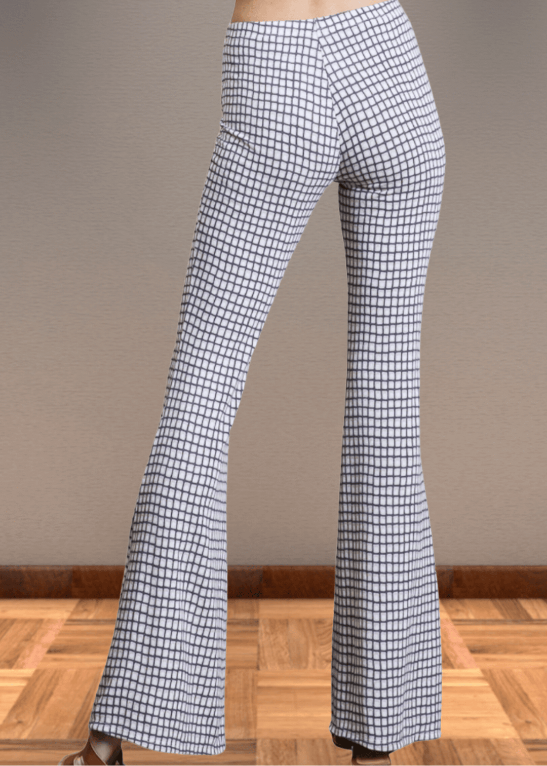 Step up your style game with these Jersey Plaid Skinny Flares, designed to flatter every curve with their mid-rise, slim-fit cut that elegantly flares at the ankle. Made from a luxuriously soft jersey fabric blend, they offer unbeatable comfort and stretch for all-day wear. The timeless black and off-white plaid pattern adds a bold yet classic touch, making these pants perfect for turning heads whether at the office or out on the town. Bucket List Style P5009D