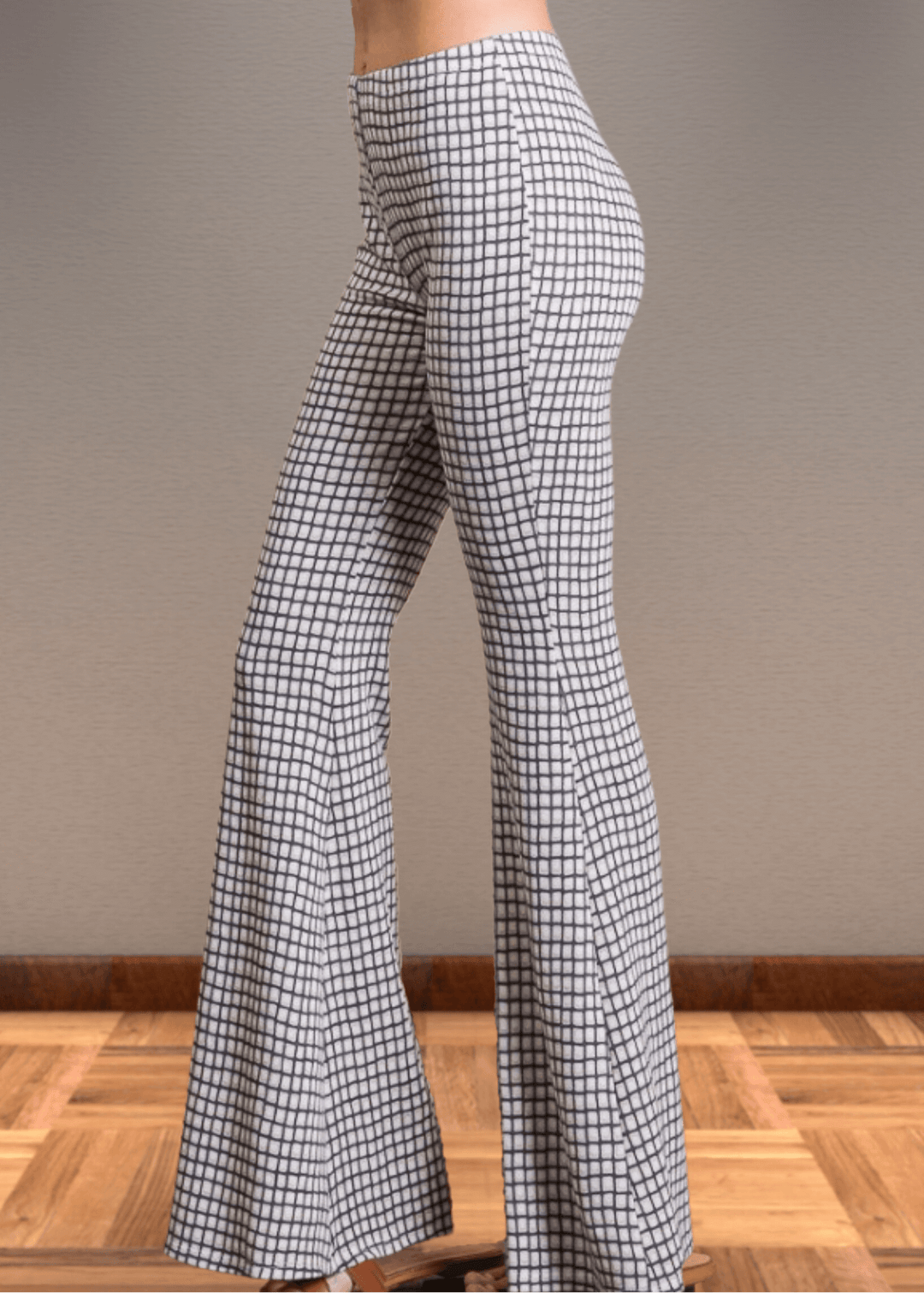 Step up your style game with these Jersey Plaid Skinny Flares, designed to flatter every curve with their mid-rise, slim-fit cut that elegantly flares at the ankle. Made from a luxuriously soft jersey fabric blend, they offer unbeatable comfort and stretch for all-day wear. The timeless black and off-white plaid pattern adds a bold yet classic touch, making these pants perfect for turning heads whether at the office or out on the town. Bucket List Style P5009D