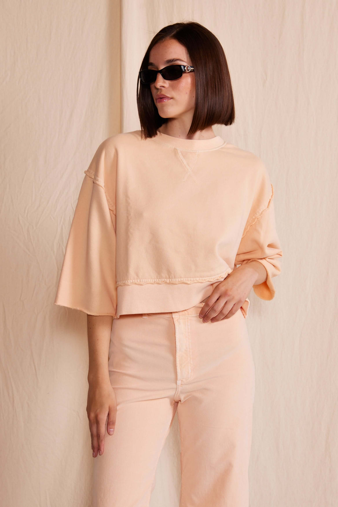 Elevate your wardrobe with the People of Leisure Dana Top made in USA, a masterpiece of sustainable elegance. Made from 100% organic cotton, this long-sleeve shirt embodies ethical fashion and luxurious comfort.