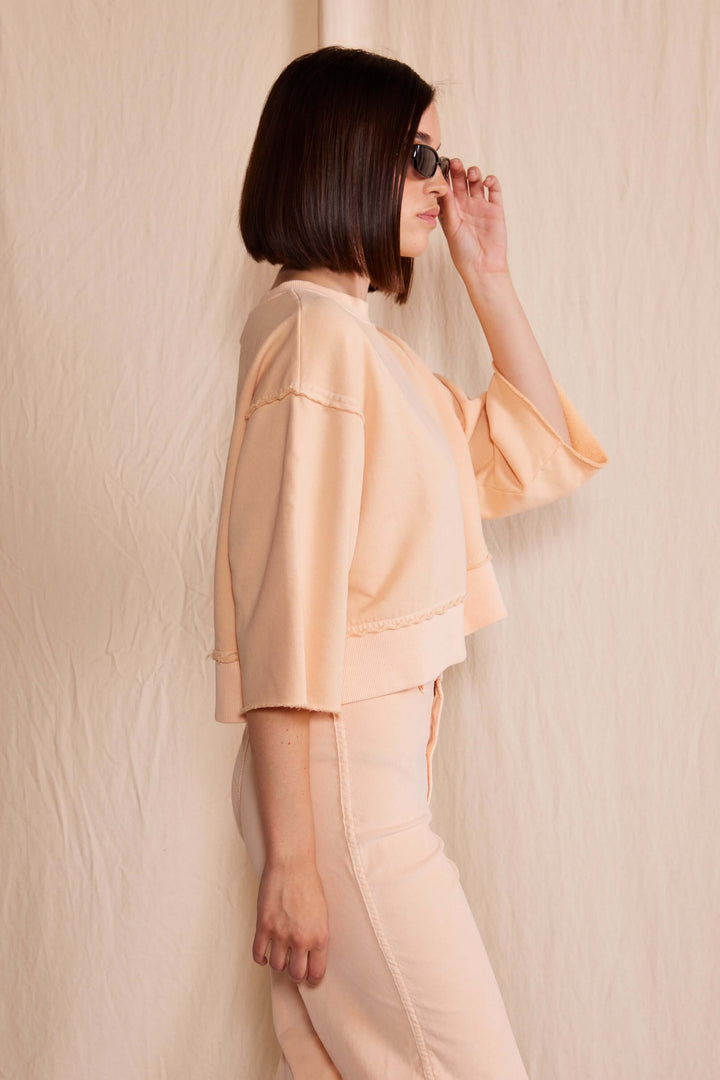 Elevate your wardrobe with the People of Leisure Dana Top made in USA, a masterpiece of sustainable elegance. Made from 100% organic cotton, this long-sleeve shirt embodies ethical fashion and luxurious comfort.