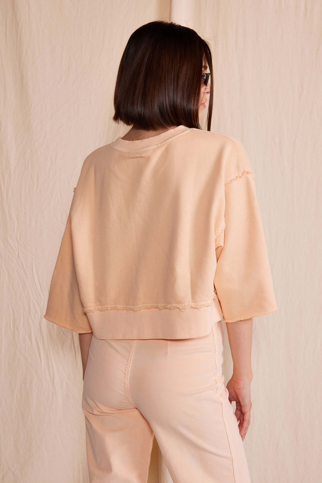 Elevate your wardrobe with the People of Leisure Dana Top made in USA, a masterpiece of sustainable elegance. Made from 100% organic cotton, this long-sleeve shirt embodies ethical fashion and luxurious comfort.