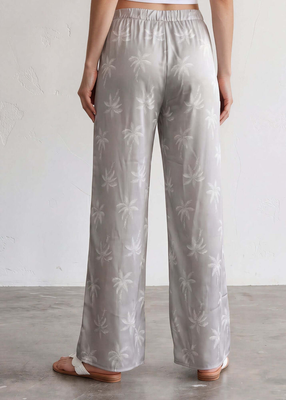  Presley Palm Tree Wide Leg Pants — a relaxed wide-leg style with a tonal palm print, elastic waist & drawstring. Made in USA. Perfect for resort & vacation.