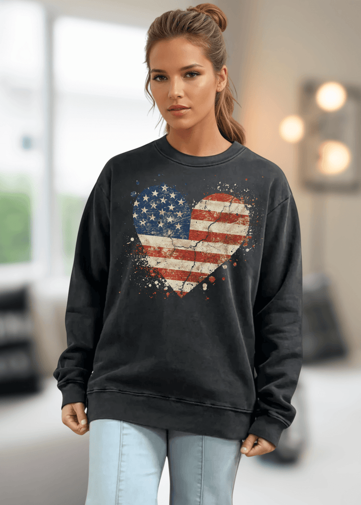 Celebrate American pride with this heavyweight sweatshirt, featuring a distressed flag heart graphic on pigment-dyed cotton fleece. The relaxed crew neck silhouette and long sleeves deliver comfort through fall and winter months. Crafted from 100% preshrunk cotton and made in the USA, this piece resists fading and maintains its shape wash after wash. 
