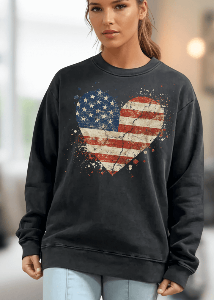 Celebrate American pride with this heavyweight sweatshirt, featuring a distressed flag heart graphic on pigment-dyed cotton fleece. The relaxed crew neck silhouette and long sleeves deliver comfort through fall and winter months. Crafted from 100% preshrunk cotton and made in the USA, this piece resists fading and maintains its shape wash after wash. 