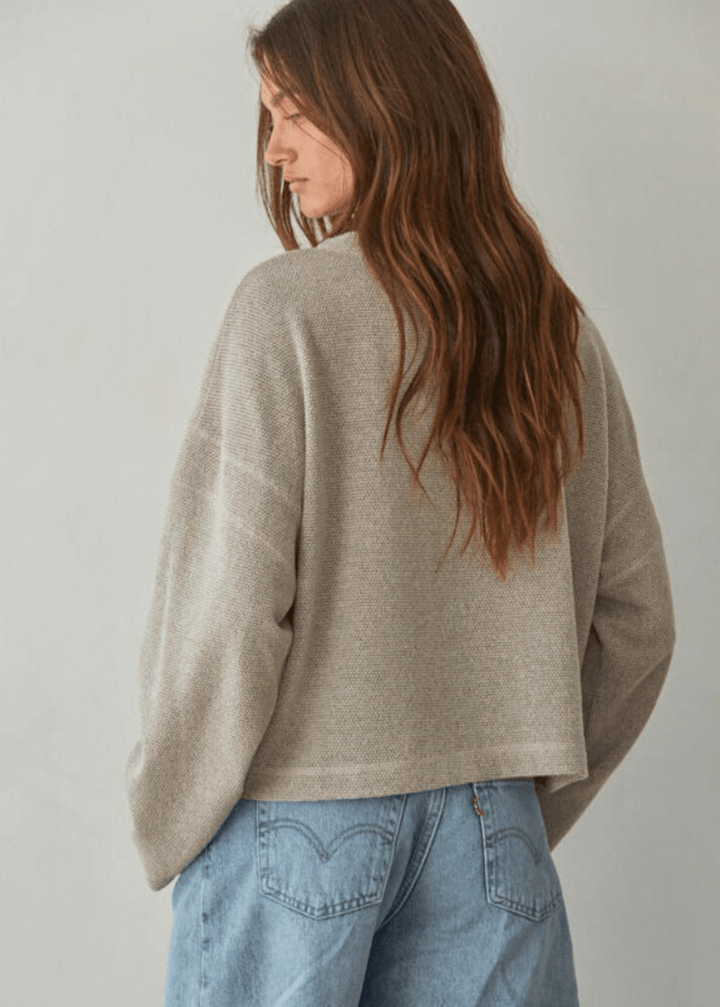 Embrace cozy elegance with this American made Perfect Fall Sweater in Taupe. Featuring a soft knit Hacci fabric and a flattering round neck, its medium length and loose fit offer comfort without sacrificing style.