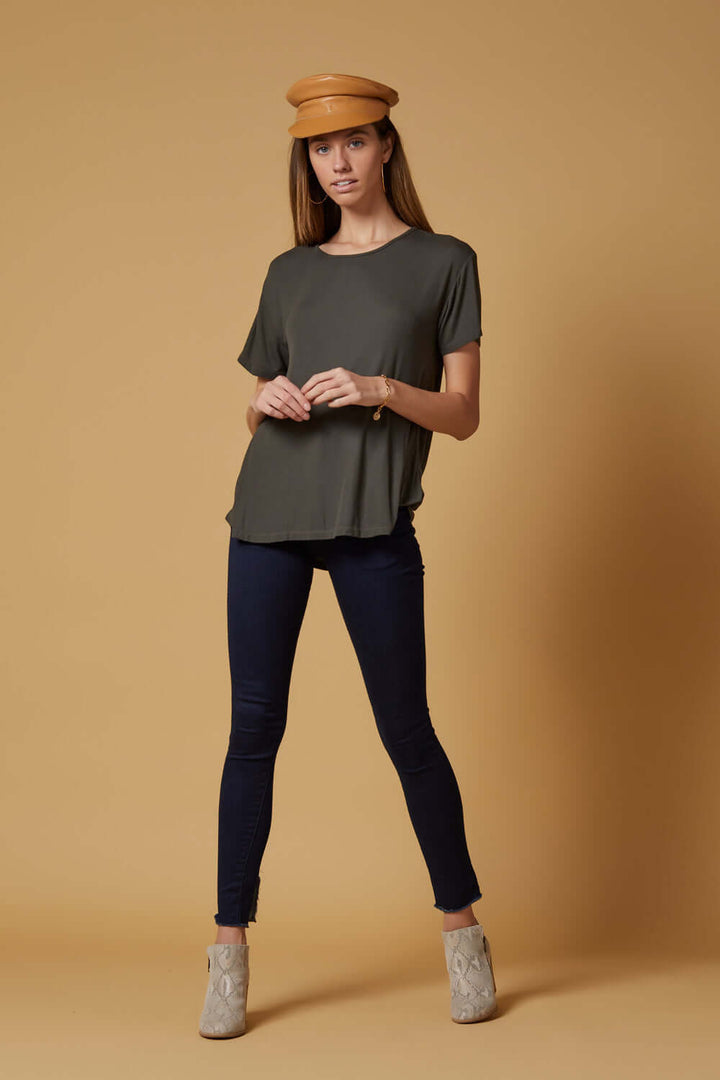 People of Leisure In a deep indigo shade, these high-rise, slim-straight skinnies are ultra stretchy and comfortable. They also feature a unique raw hem detailing that sits below the ankle. 