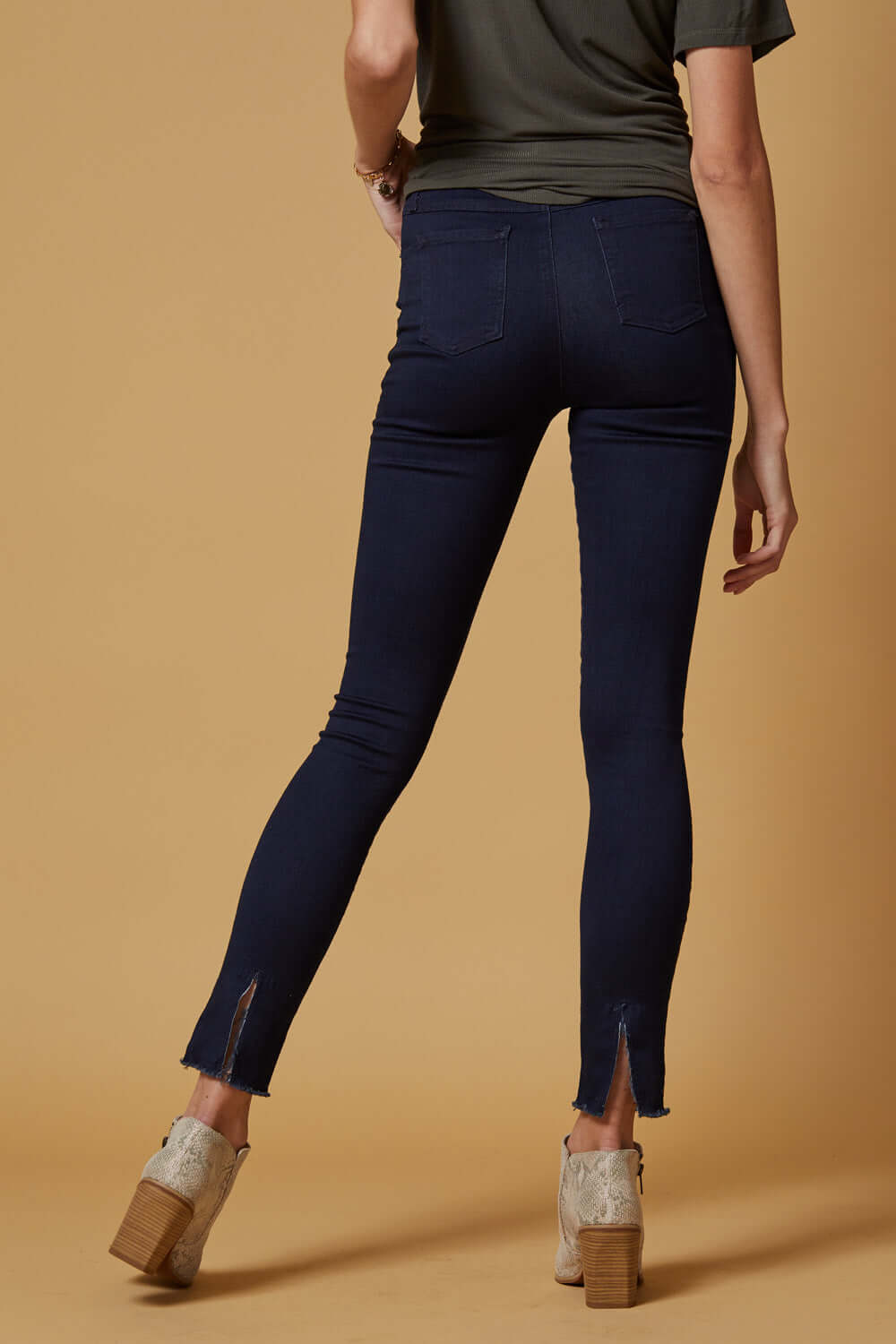 People of Leisure In a deep indigo shade, these high-rise, slim-straight skinnies are ultra stretchy and comfortable. They also feature a unique raw hem detailing that sits below the ankle. 
