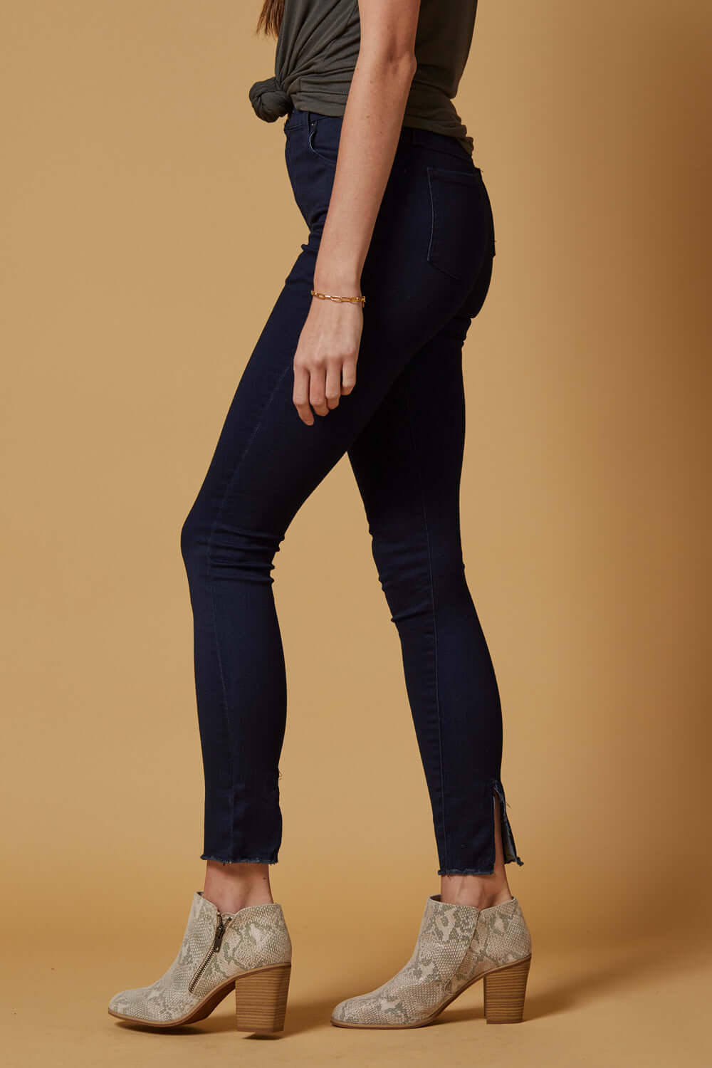 People of Leisure In a deep indigo shade, these high-rise, slim-straight skinnies are ultra stretchy and comfortable. They also feature a unique raw hem detailing that sits below the ankle. 