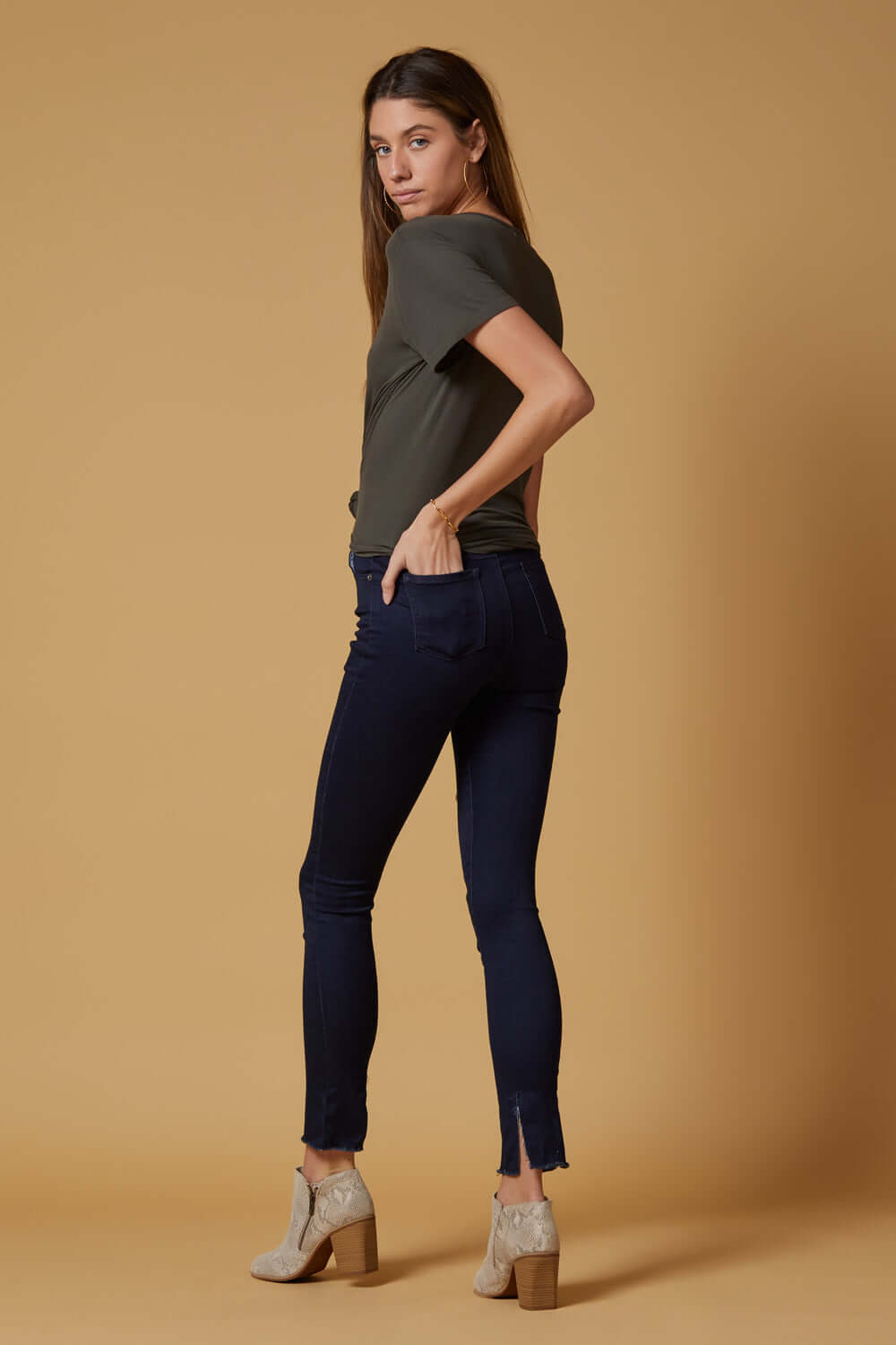 People of Leisure In a deep indigo shade, these high-rise, slim-straight skinnies are ultra stretchy and comfortable. They also feature a unique raw hem detailing that sits below the ankle. 