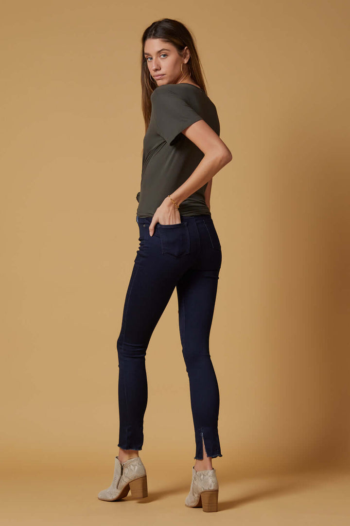 People of Leisure In a deep indigo shade, these high-rise, slim-straight skinnies are ultra stretchy and comfortable. They also feature a unique raw hem detailing that sits below the ankle. 