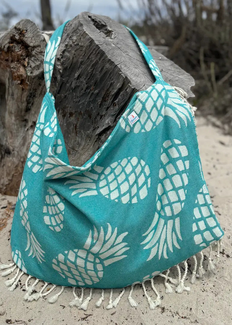Shop the Beachables Pattern 3-in-1 Turkish Cotton Beach Bag – converts from bag to towel to chair cover. Sand-resistant, quick-dry, machine washable. Made in USA.