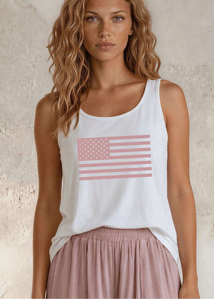 Say it in something made here! USA-made Patriotic Pink USA Flag Graphic tank in white garment wash. Soft 95% cotton, relaxed fit, grown &amp; sewn in America.