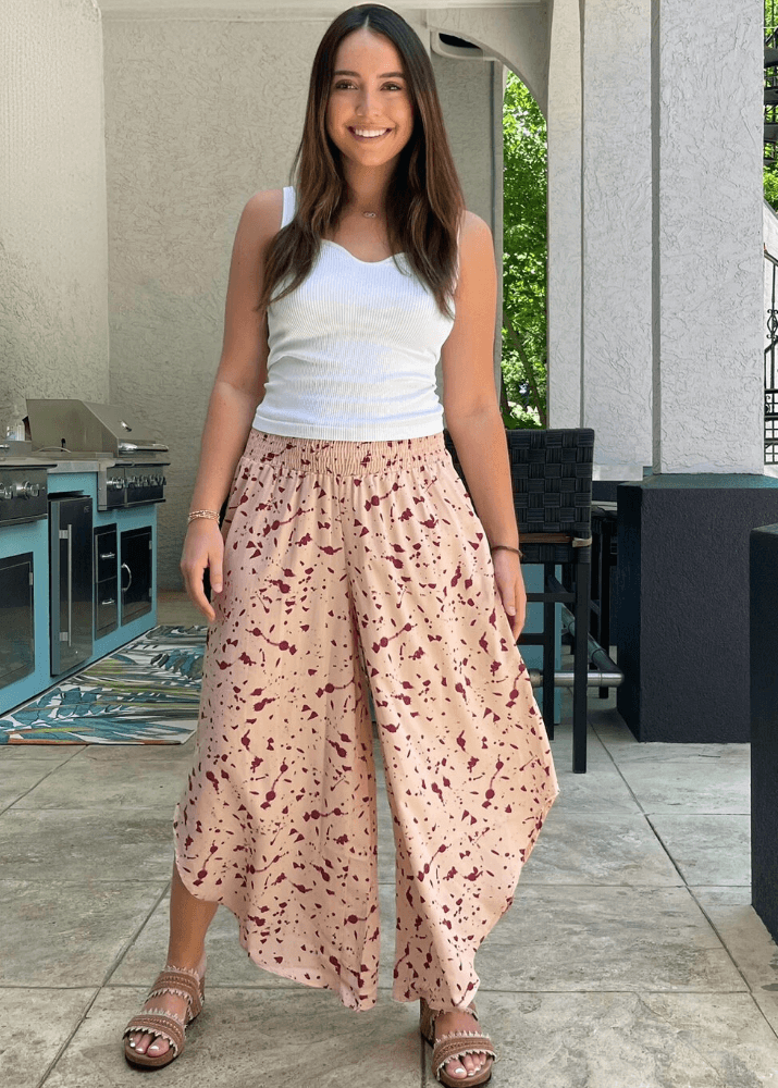 Made in USA Women's Fun Pink Splatter Printed Smocked Waist Pants with Pockets and Asymmetrical Cropped Hem | Brand: Bucket List Style P5024  | Made in USA 