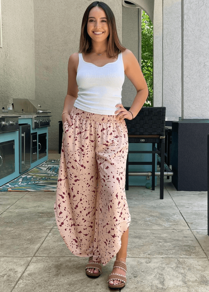 Made in USA Women's Fun Pink Splatter Printed Smocked Waist Pants with Pockets and Asymmetrical Cropped Hem | Brand: Bucket List Style P5024  | Made in USA 