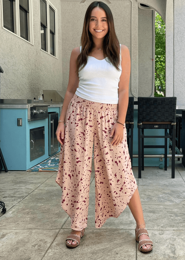 Made in USA Women's Fun Pink Splatter Printed Smocked Waist Pants with Pockets and Asymmetrical Cropped Hem | Brand: Bucket List Style P5024  | Made in USA 