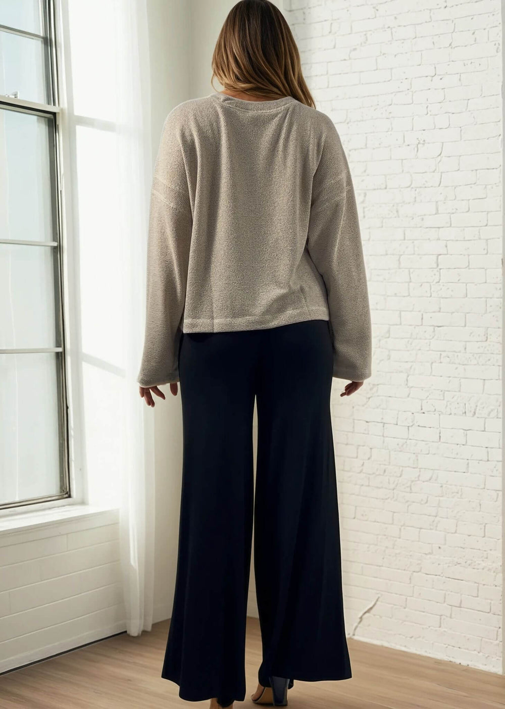 Experience ultimate comfort and style with these Soft Rayon Jersey Palazzo Pants in Solid Black, crafted in the USA. Featuring a flattering fold-over waist and a wide-leg silhouette, they offer a relaxed yet chic look. Made from a stretchy blend of rayon and spandex, these pants move with you while maintaining their softness.