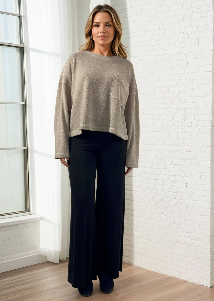 Experience ultimate comfort and style with these Soft Rayon Jersey Palazzo Pants in Solid Black, crafted in the USA. Featuring a flattering fold-over waist and a wide-leg silhouette, they offer a relaxed yet chic look. Made from a stretchy blend of rayon and spandex, these pants move with you while maintaining their softness.