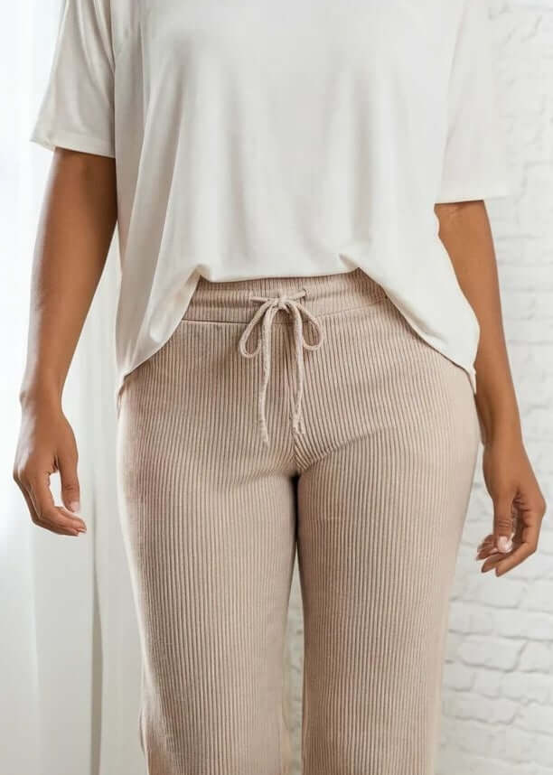 Elevate your everyday wardrobe with these Ribbed Knit Lettuce Hem Pants, designed for effortless comfort and timeless style. Crafted from a luxurious blend of 95% cotton and 5% spandex - Made in USA