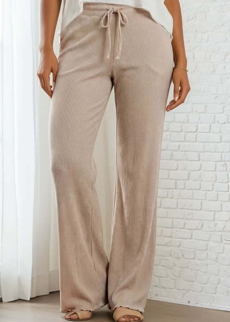 Elevate your everyday wardrobe with these Ribbed Knit Lettuce Hem Pants, designed for effortless comfort and timeless style. Crafted from a luxurious blend of 95% cotton and 5% spandex - Made in USA