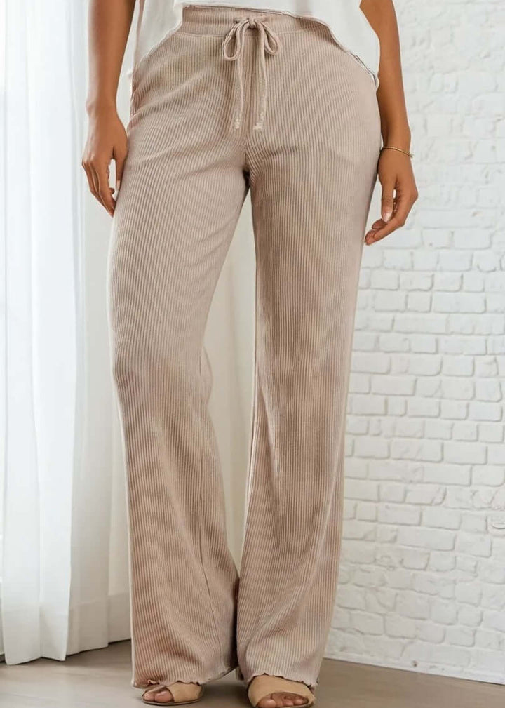 Elevate your everyday wardrobe with these Ribbed Knit Lettuce Hem Pants, designed for effortless comfort and timeless style. Crafted from a luxurious blend of 95% cotton and 5% spandex - Made in USA