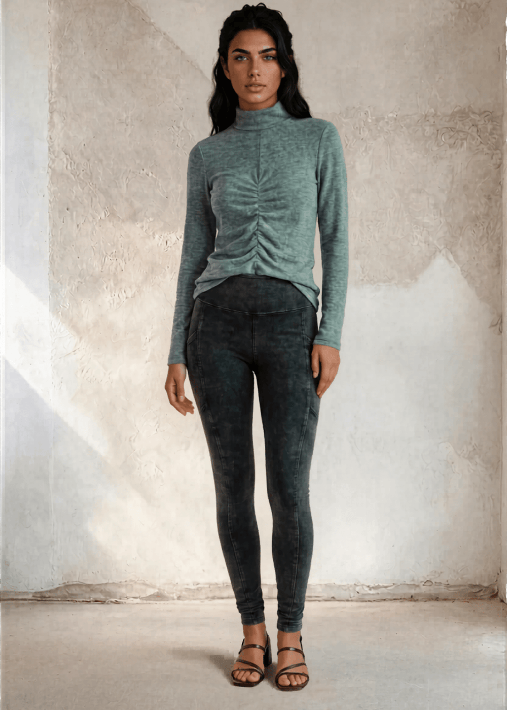 This Long Sleeve Mock Neck Top is a must-have for any wardrobe. It's perfect to wear under Jackets for a touch of uniqueness. Made in the USA with soft and stretchy ribbed knit fabric.