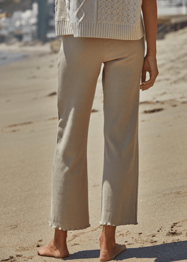 Elevate your everyday wardrobe with these Ribbed Knit Lettuce Hem Pants, designed for effortless comfort and timeless style. Crafted from a luxurious blend of 95% cotton and 5% spandex - Made in USA