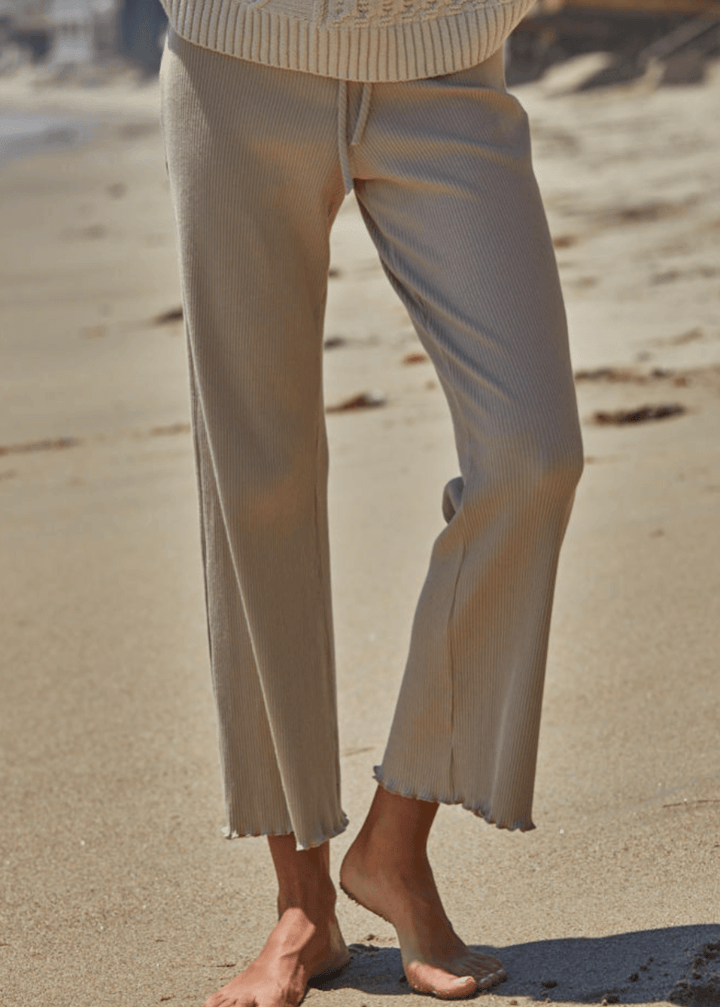 Elevate your everyday wardrobe with these Ribbed Knit Lettuce Hem Pants, designed for effortless comfort and timeless style. Crafted from a luxurious blend of 95% cotton and 5% spandex - Made in USA