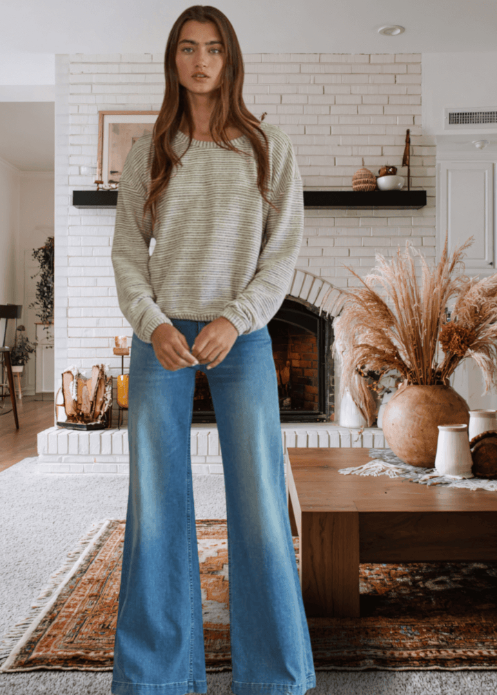 Embrace effortless comfort with the Cara Pullover, a soft and cozy sweater designed for everyday wear. Featuring a relaxed loose fit and round neckline, this just-below-waist-length top transitions seamlessly from casual to polished.  This Made in USA Ivory and Gray sweater is perfect for layering or wearing solo.