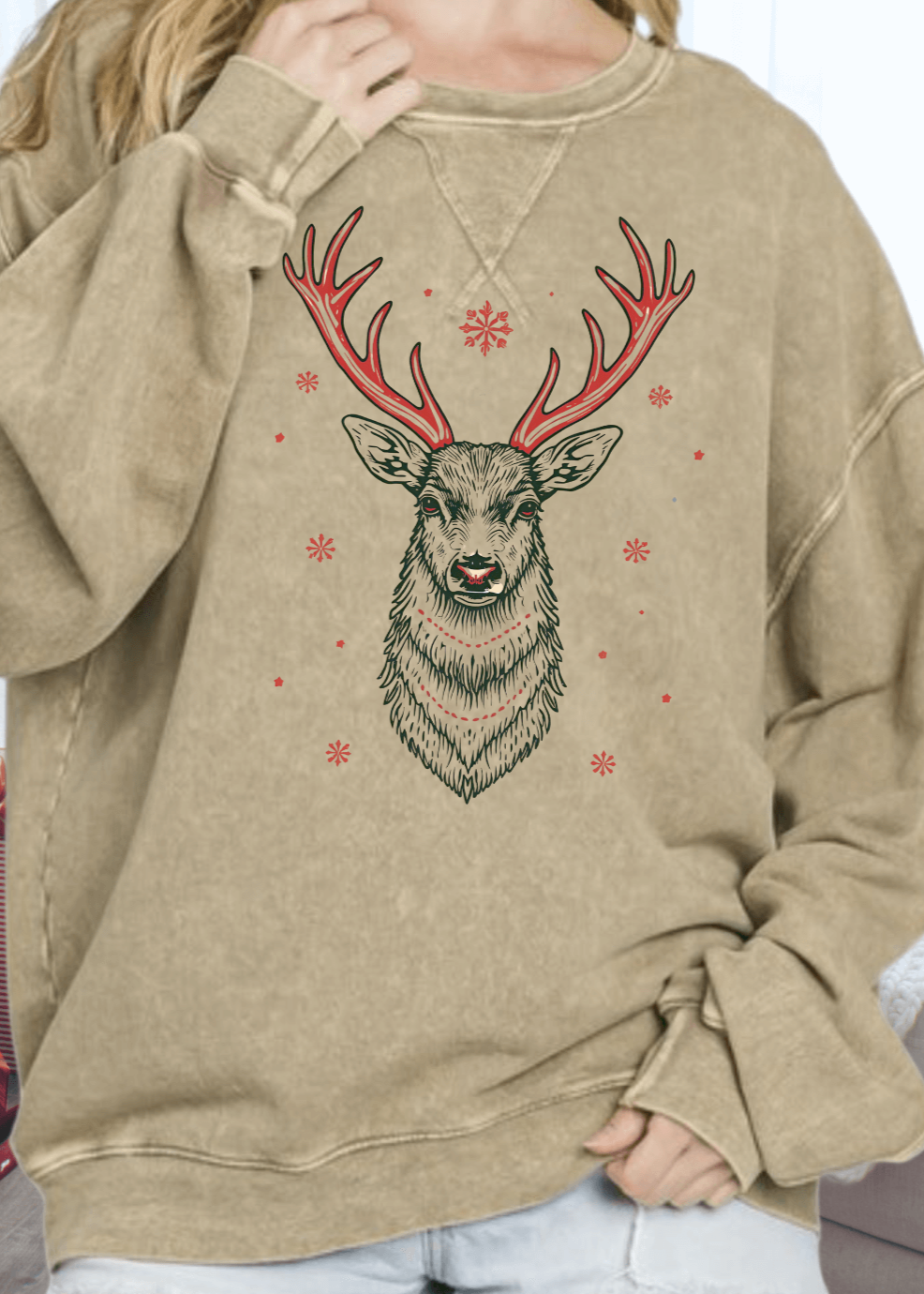 This vintage-inspired oversized sweatshirt features a striking Art Deco red antler reindeer graphic on mineral-washed antique mocha cotton. Crafted in the USA from premium 100% medium-weight cotton