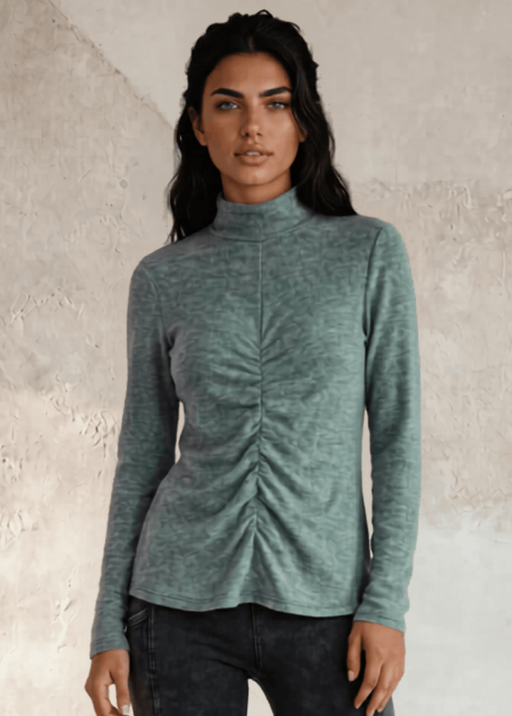 This Long Sleeve Mock Neck Top is a must-have for any wardrobe. It&