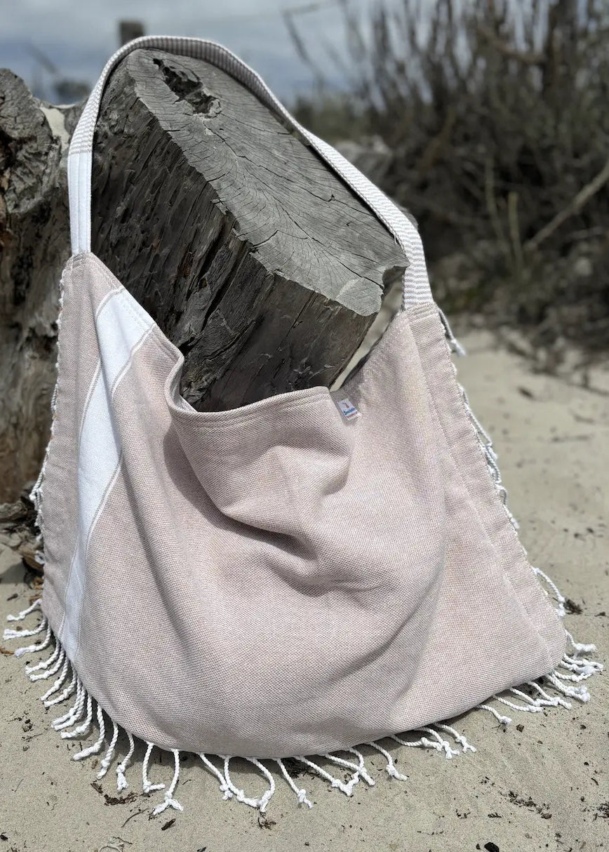 Shop the Beachables Solid 3-in-1 Turkish Cotton Beach Bag – converts from bag to towel to chair cover. Sand-resistant, quick-dry, machine washable. Made in USA.
