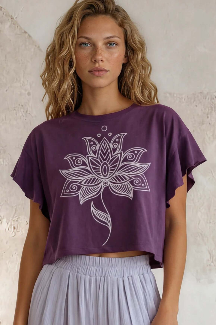 Relaxed boxy cropped top in pale periwinkle with a geometric flower print. 88% cotton French terry. Made in USA. Sizes S–L.