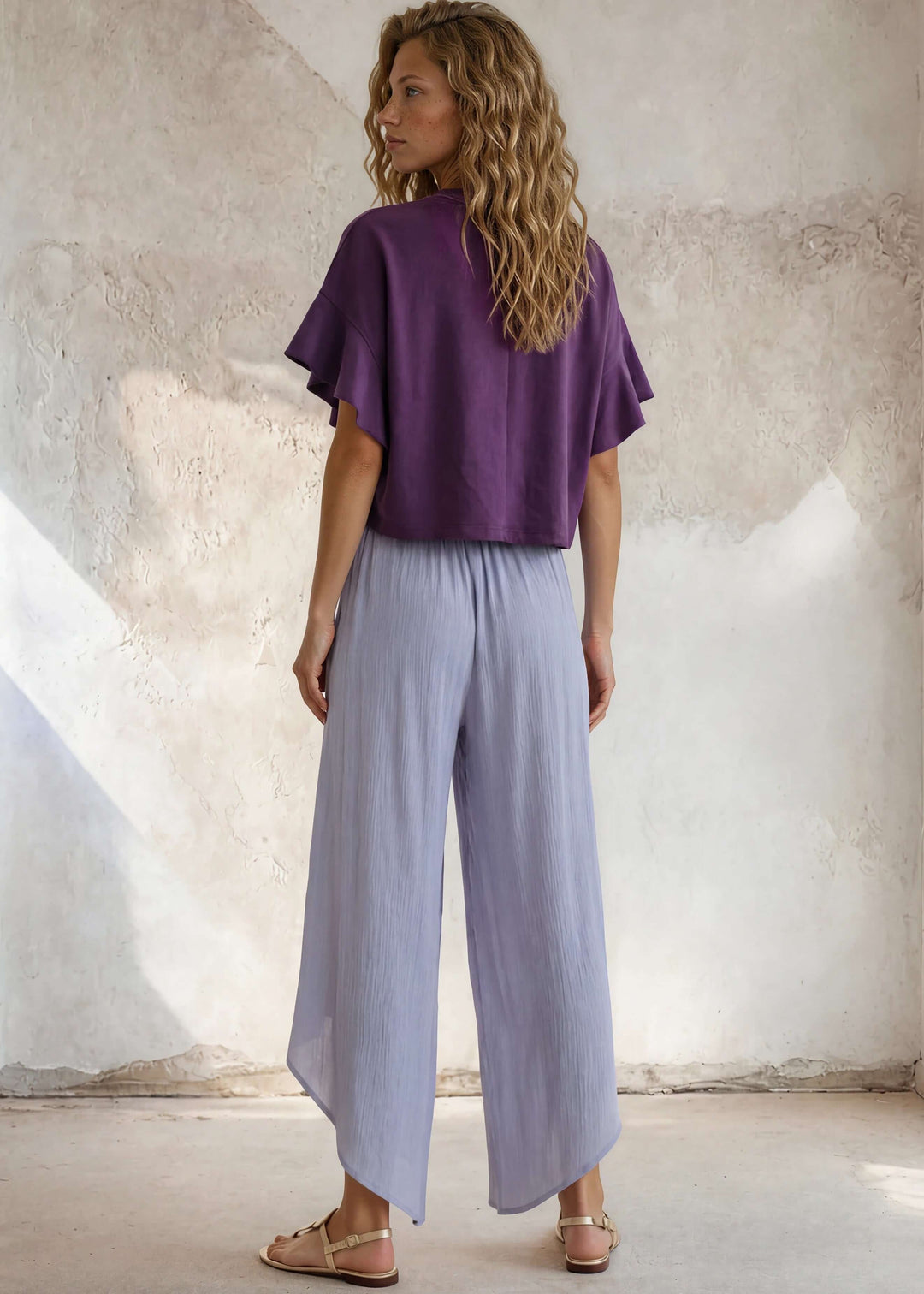 Relaxed boxy cropped top in pale periwinkle with a geometric flower print. 88% cotton French terry. Made in USA. Sizes S–L.