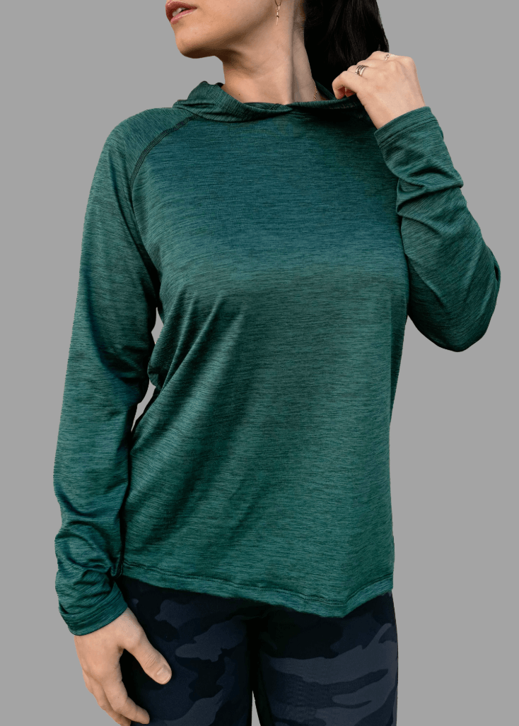 Discover premium female athleisure hoodies, 100% made in the USA. Stylish, durable, and perfect for your active lifestyle. Crafted for active women, this female sun hoodie in Scarab Green is more than just stylish—it's made to perform. 