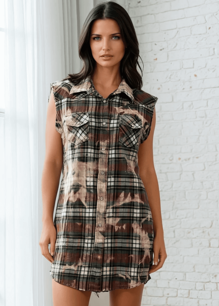 Meet The Sedona Sunset Sleeveless Plaid Flannel Tunic - a sleeveless, boho-chic essential designed for effortless layering and laid-back luxury. Crafted in Los Angeles from ultra-soft, vintage-washed plaid, this one-of-a-kind piece features hand-bleached details, raw frayed edges, and classic chest pockets for a relaxed yet elevated vibe. Its tunic length makes it versatile enough to wear open over denim shorts or buttoned up as a dress.