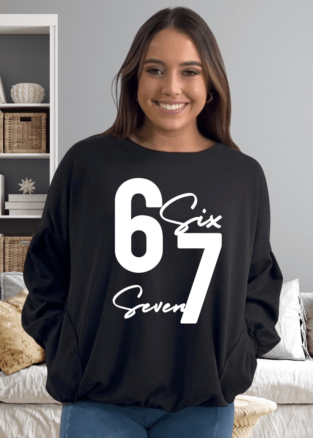 Elevate your cozy game with the "Six Seven" sweatshirt—a playful oversized essential that's anything but basic, in black with white graphic.  This medium-weight French terry piece features a bold graphic on black, paired with a chic keyhole cutout at the back for unexpected flair. Made in USA