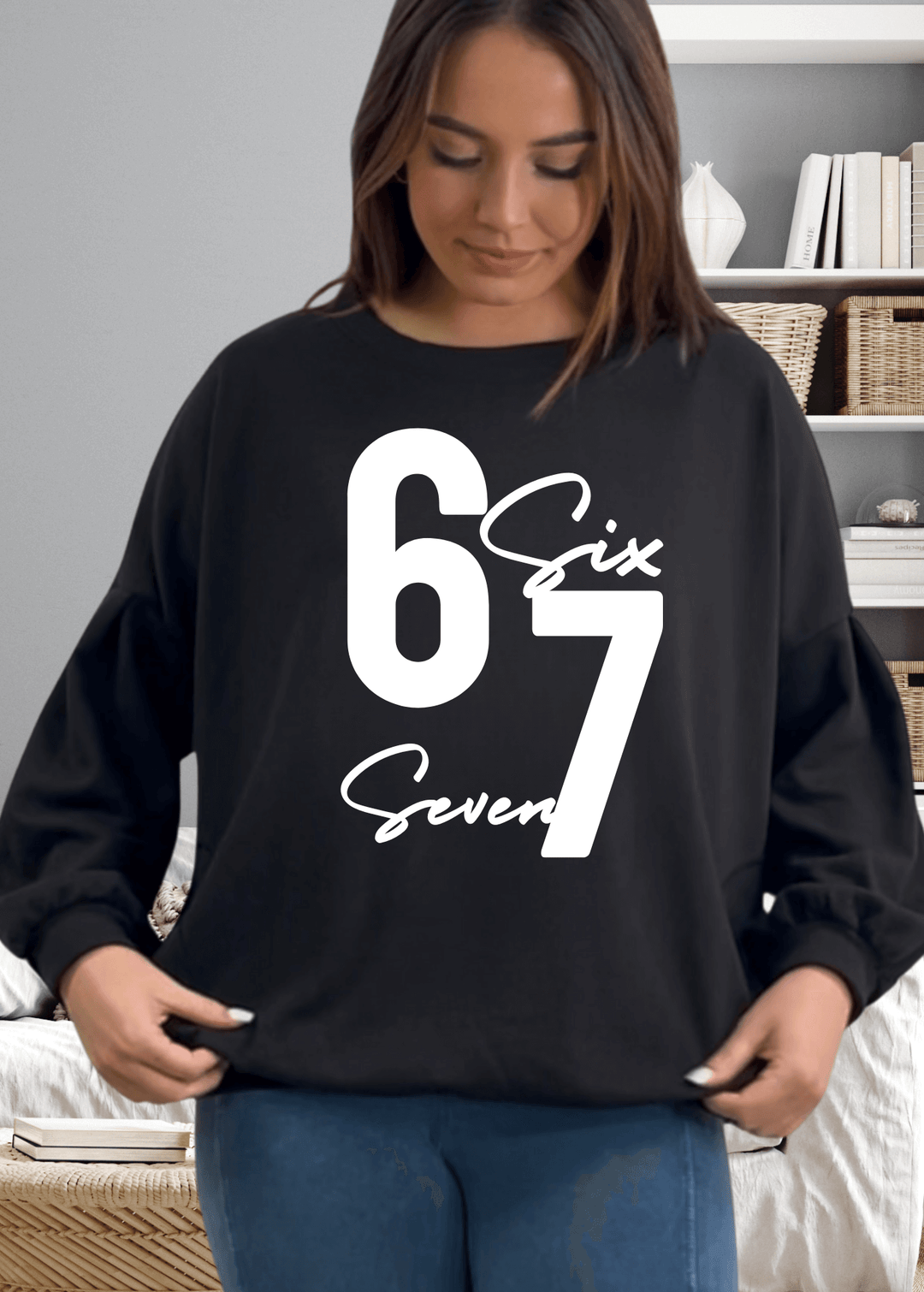 Elevate your cozy game with the "Six Seven" sweatshirt—a playful oversized essential that's anything but basic, in black with white graphic.  This medium-weight French terry piece features a bold graphic on black, paired with a chic keyhole cutout at the back for unexpected flair. Made in USA