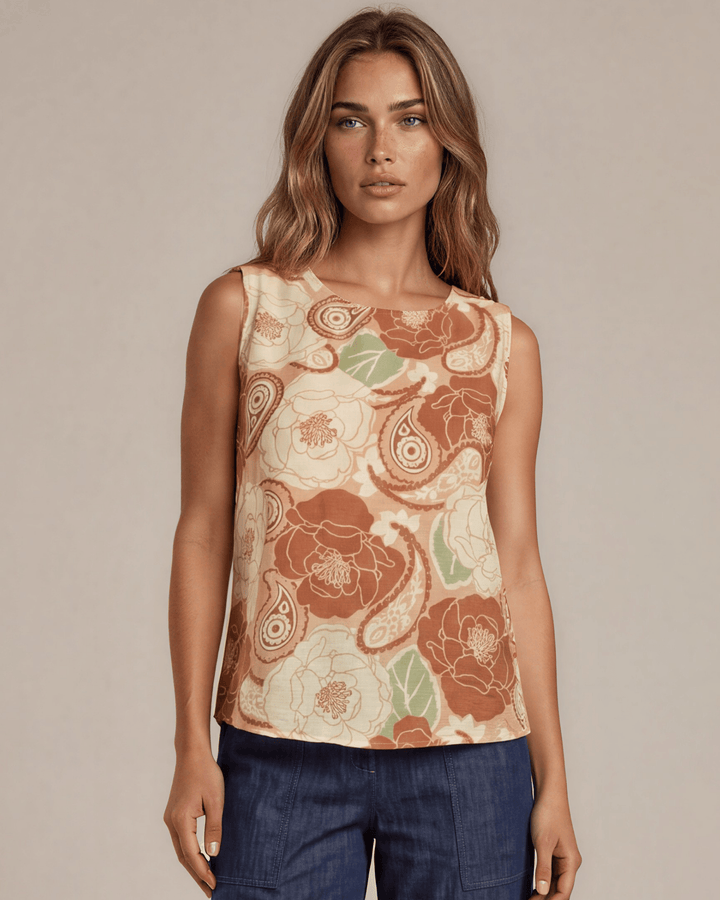 Sleeveless boat neck top in a rust floral paisley print. Hammered satin look, Rayon Linen Blend Fabric, longer in back. Made in USA.
