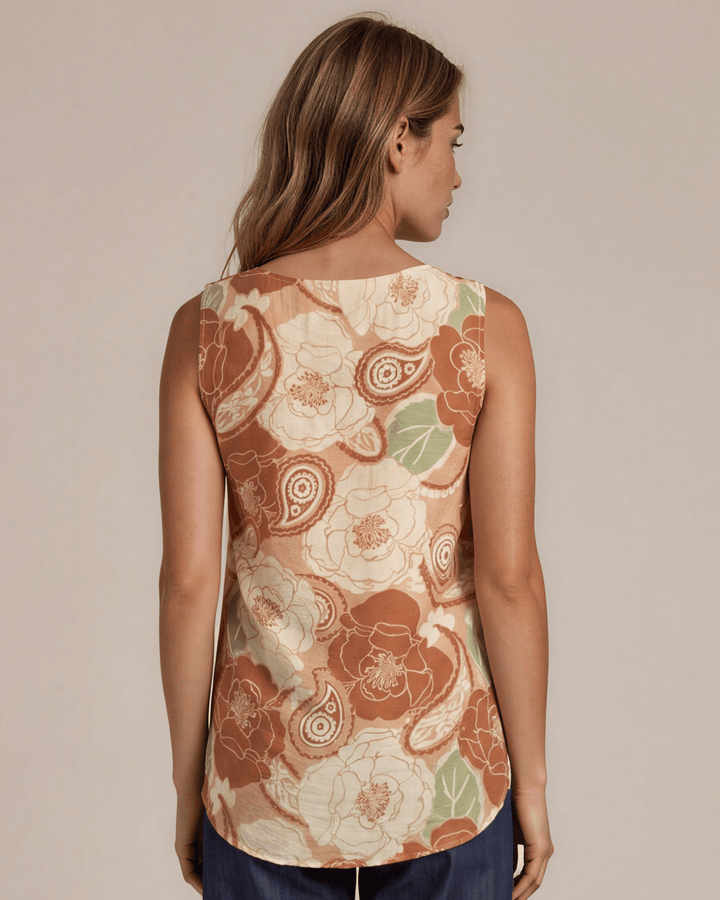 Sleeveless boat neck top in a rust floral paisley print. Hammered satin look, Rayon Linen Blend Fabric, longer in back. Made in USA.