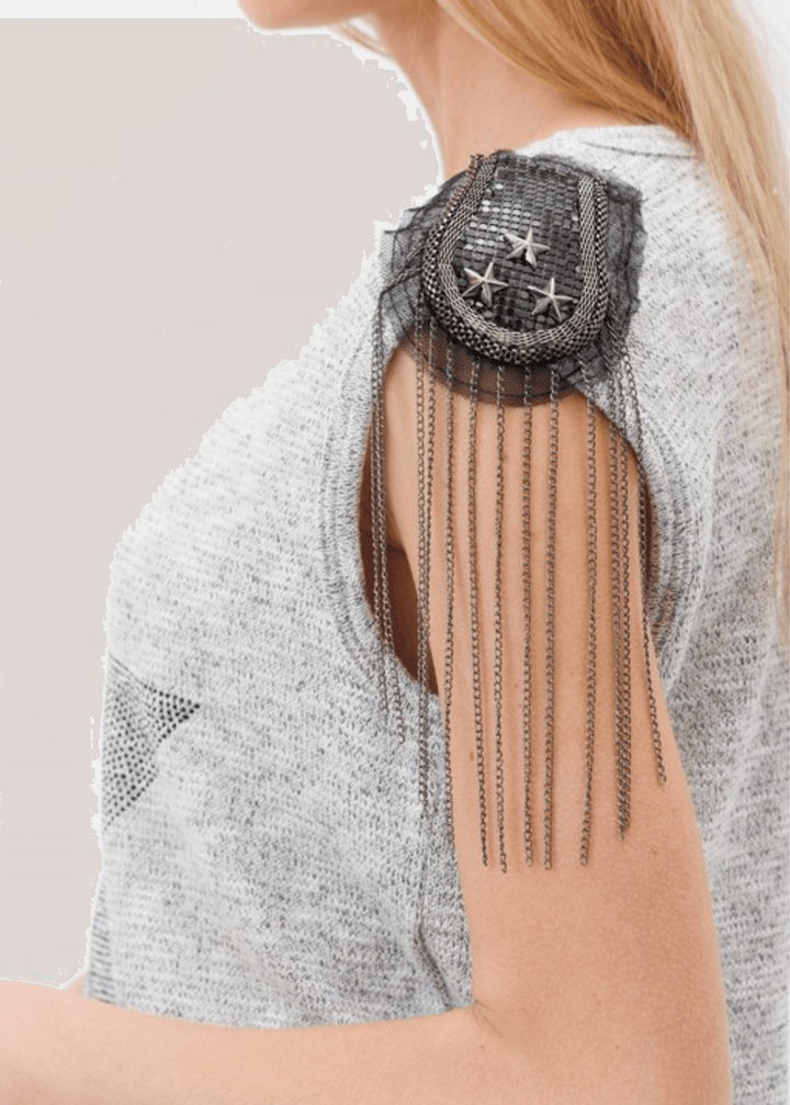 Make a bold statement with this standout made in USA sleeveless top, designed to turn heads with its sparkling star-embellished beads and shoulder fringe. The heathered gray loose knit fabric drapes beautifully while the built-in stretch ensures all-day comfort and ease of movement. 