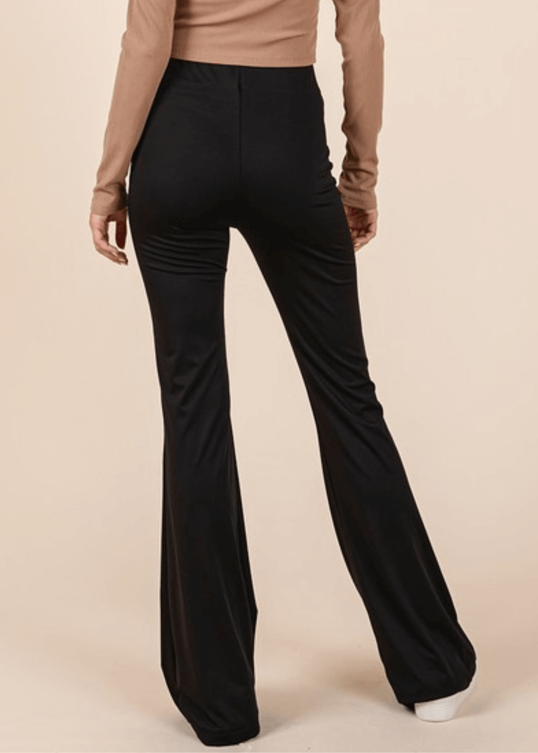 Enjoy everyday comfort with these Stretchy Soft Flare Black Athleisure Pants. Designed in USA with a high-rise silhouette and flared hem, they deliver a flattering, versatile look that transitions seamlessly from studio to street. 