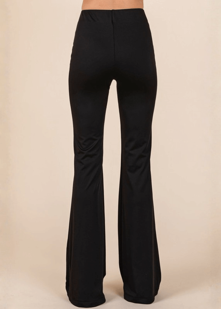 Enjoy everyday comfort with these Stretchy Soft Flare Black Athleisure Pants. Designed in USA with a high-rise silhouette and flared hem, they deliver a flattering, versatile look that transitions seamlessly from studio to street. 