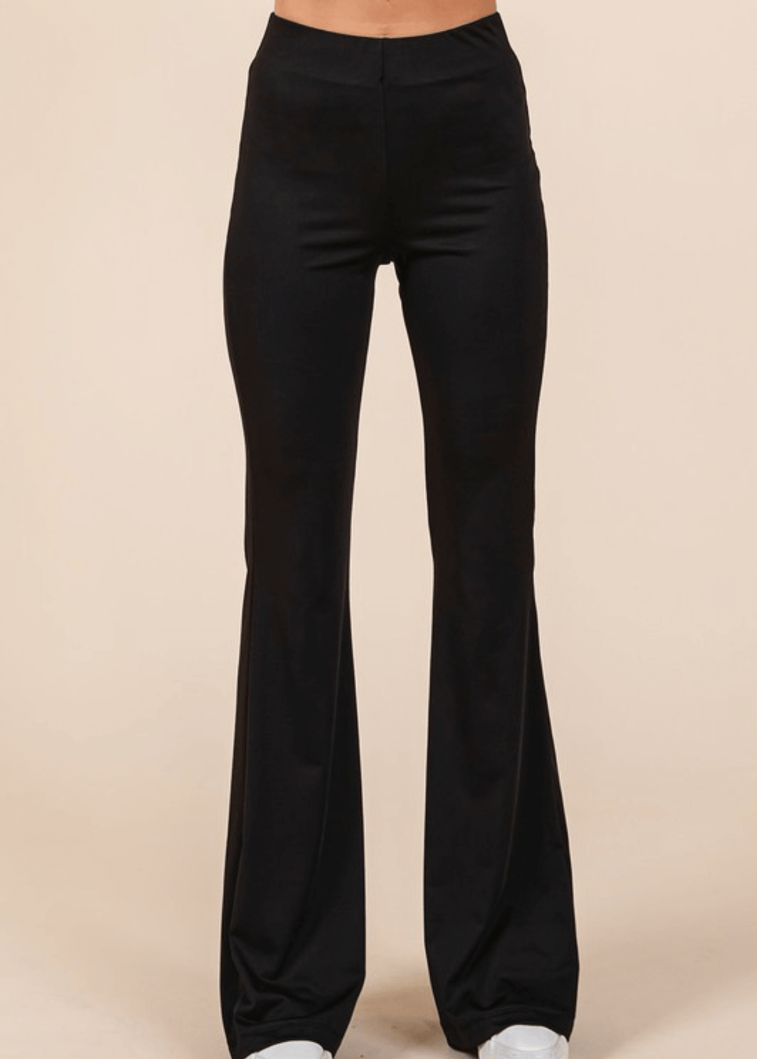 Enjoy everyday comfort with these Stretchy Soft Flare Black Athleisure Pants. Designed in USA with a high-rise silhouette and flared hem, they deliver a flattering, versatile look that transitions seamlessly from studio to street. 