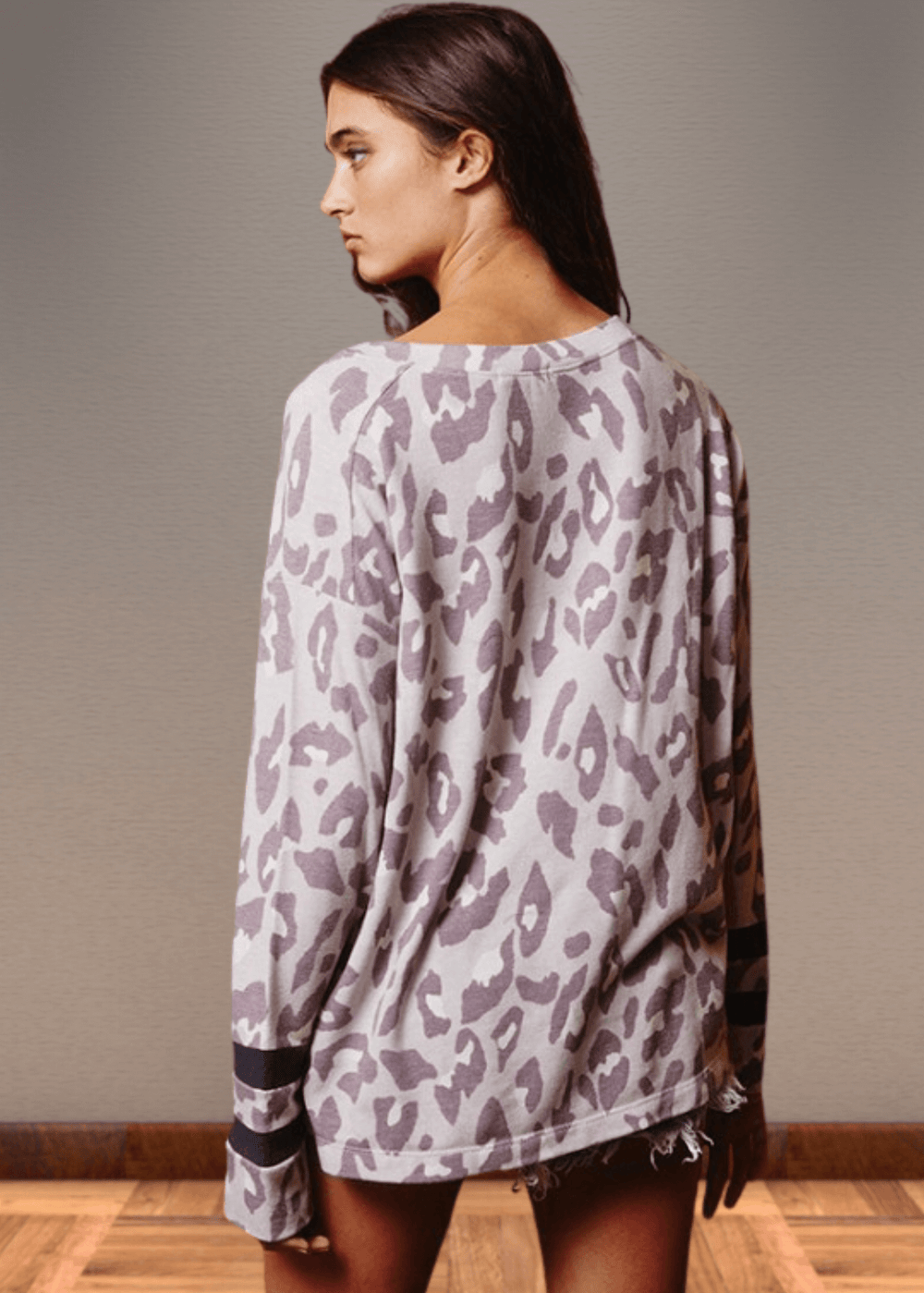 Experience effortless style with the Dusty Lavender Animal Print Top. Its wide round neckline and relaxed fit provide comfort without compromising on fashion.  Bucket List Style T1100