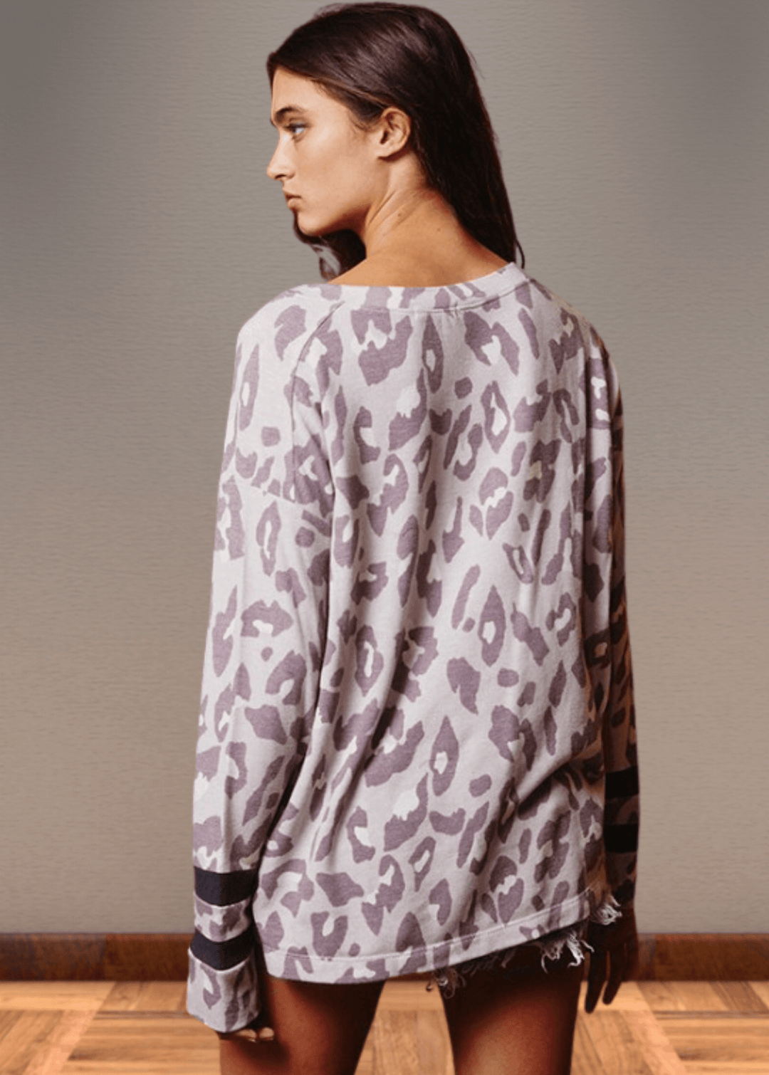 Experience effortless style with the Dusty Lavender Animal Print Top. Its wide round neckline and relaxed fit provide comfort without compromising on fashion.  Bucket List Style T1100