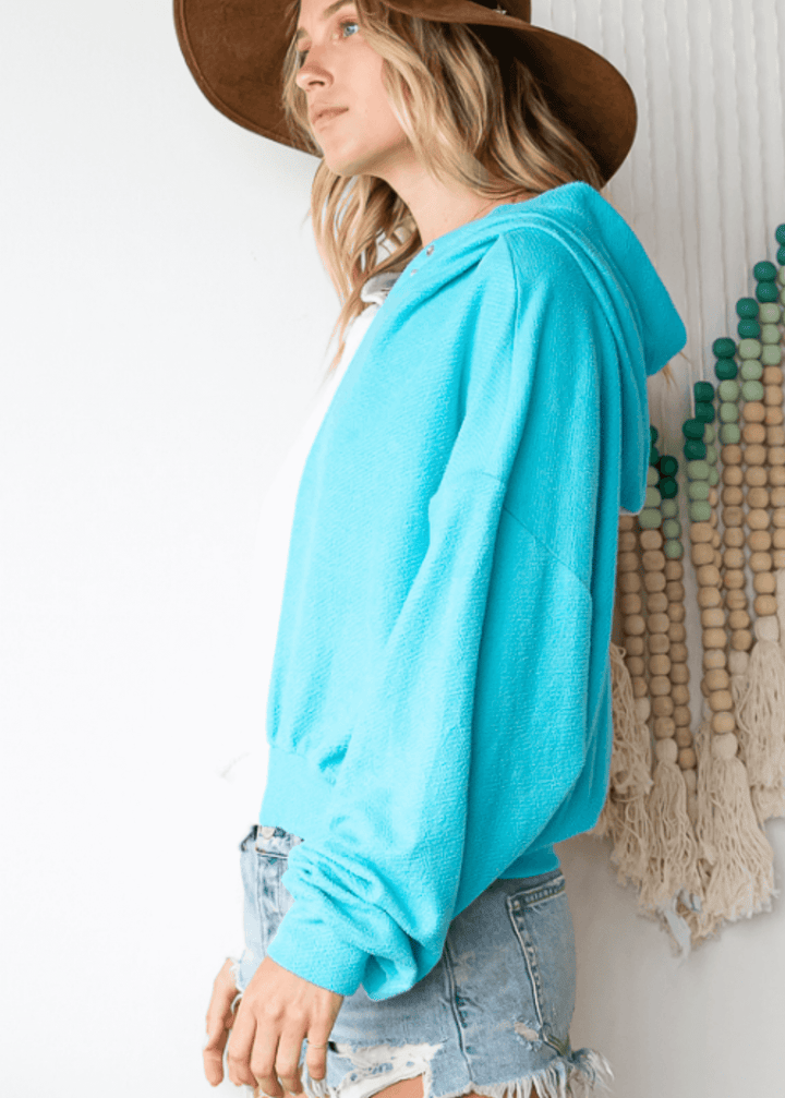 Cozy up in the Gina French Terry Hoodie, where aqua meets light gray in a playful color block design. Its relaxed fit and medium-weight fabric offer just the right amount of warmth, perfect for lounging or layering on cooler days. Bucket List Style# T1767