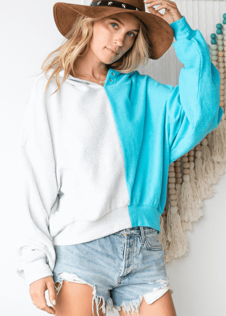 Cozy up in the Gina French Terry Hoodie, where aqua meets light gray in a playful color block design. Its relaxed fit and medium-weight fabric offer just the right amount of warmth, perfect for lounging or layering on cooler days. Bucket List Style# T1767