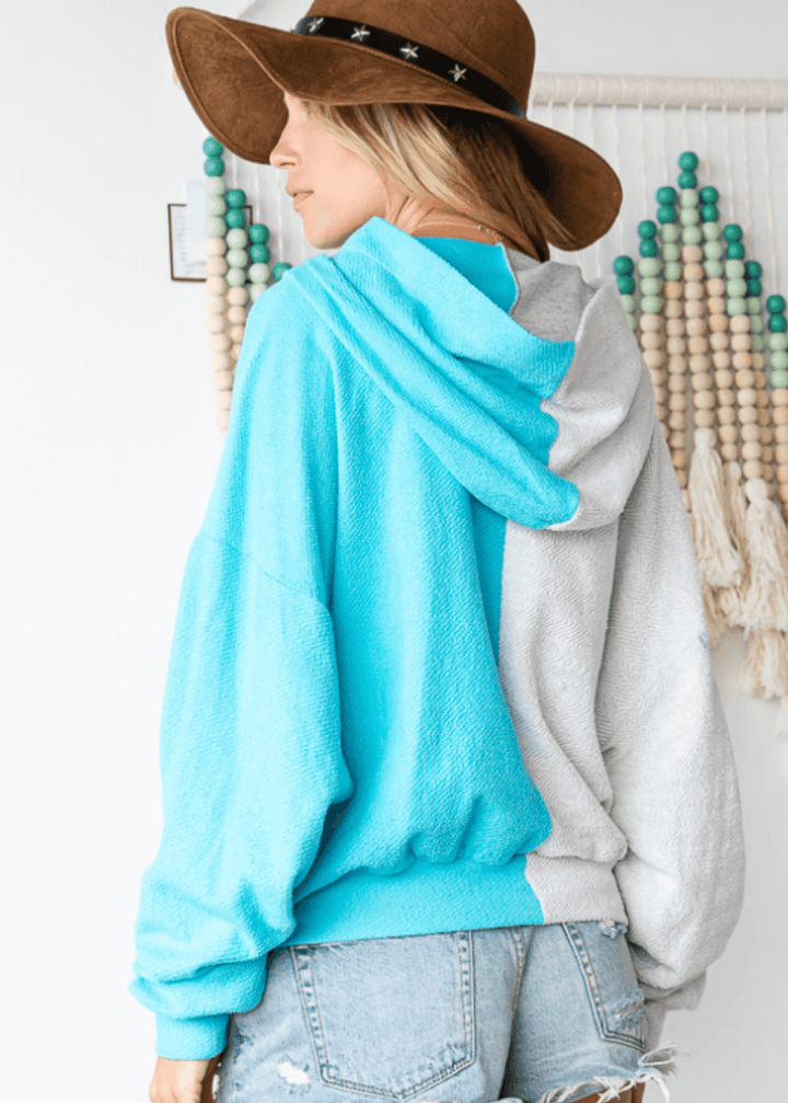 Cozy up in the Gina French Terry Hoodie, where aqua meets light gray in a playful color block design. Its relaxed fit and medium-weight fabric offer just the right amount of warmth, perfect for lounging or layering on cooler days. Bucket List Style# T1767