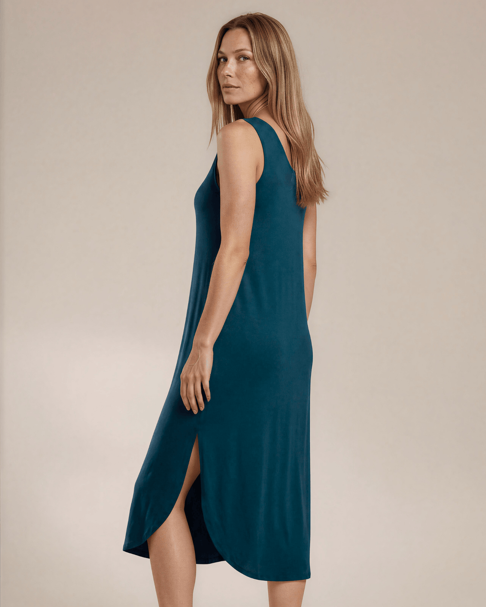 Shop the Sammie Sleeveless Maxi Dress in teal. Relaxed fit, scoop neck, side pockets & slits. 95% Rayon, 5% Spandex. Made in USA. Free shipping may apply.